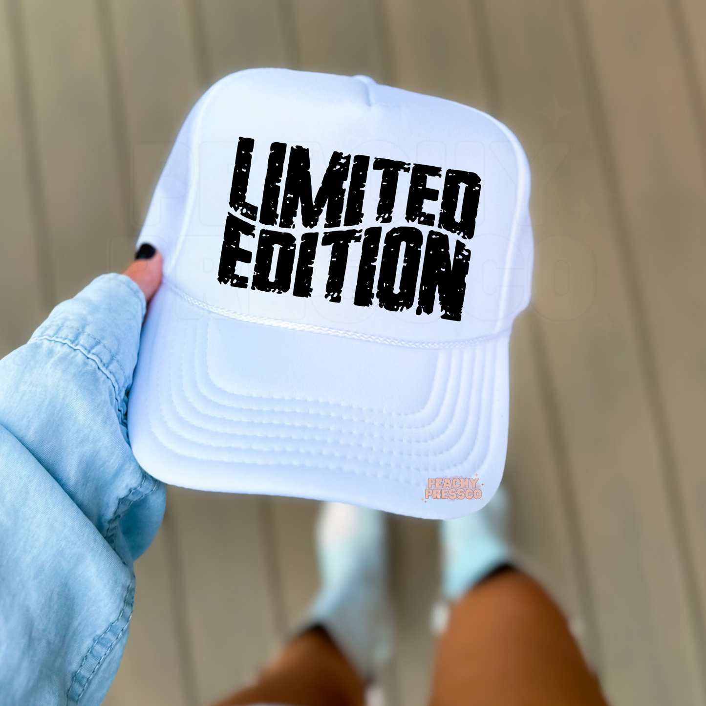White foam trucker hat featuring bold distressed "LIMITED EDITION" lettering in black. Trendy unisex trucker hat perfect for everyday wear, gifts, country concerts, and casual outfits.