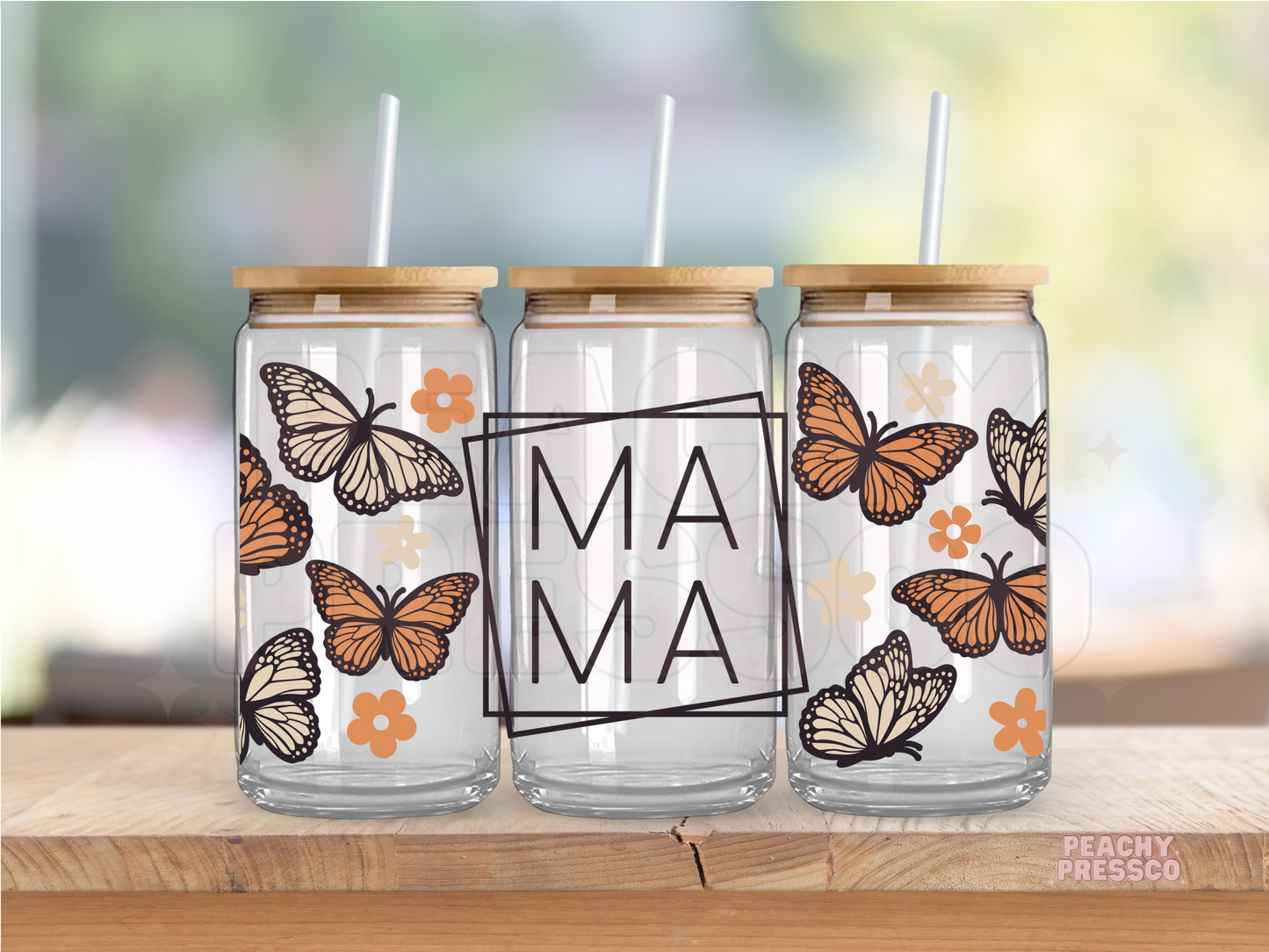16oz glass cup featuring monarch butterflies, boho flowers, and minimalist Mama typography with bamboo lid and straw.