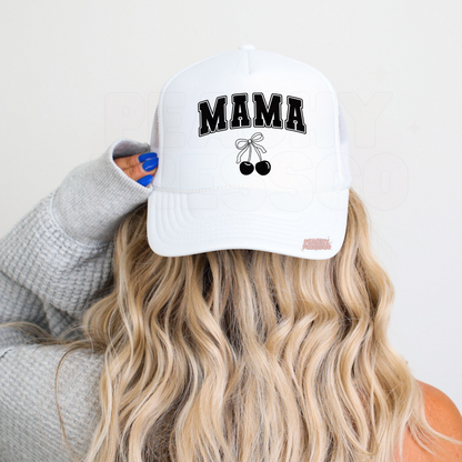 White foam trucker hat with bold varsity "MAMA" lettering and a simple black cherry bow design. Cute minimalist mom hat for everyday outfits, school pickup, Mother's Day gifts, and casual summer style.