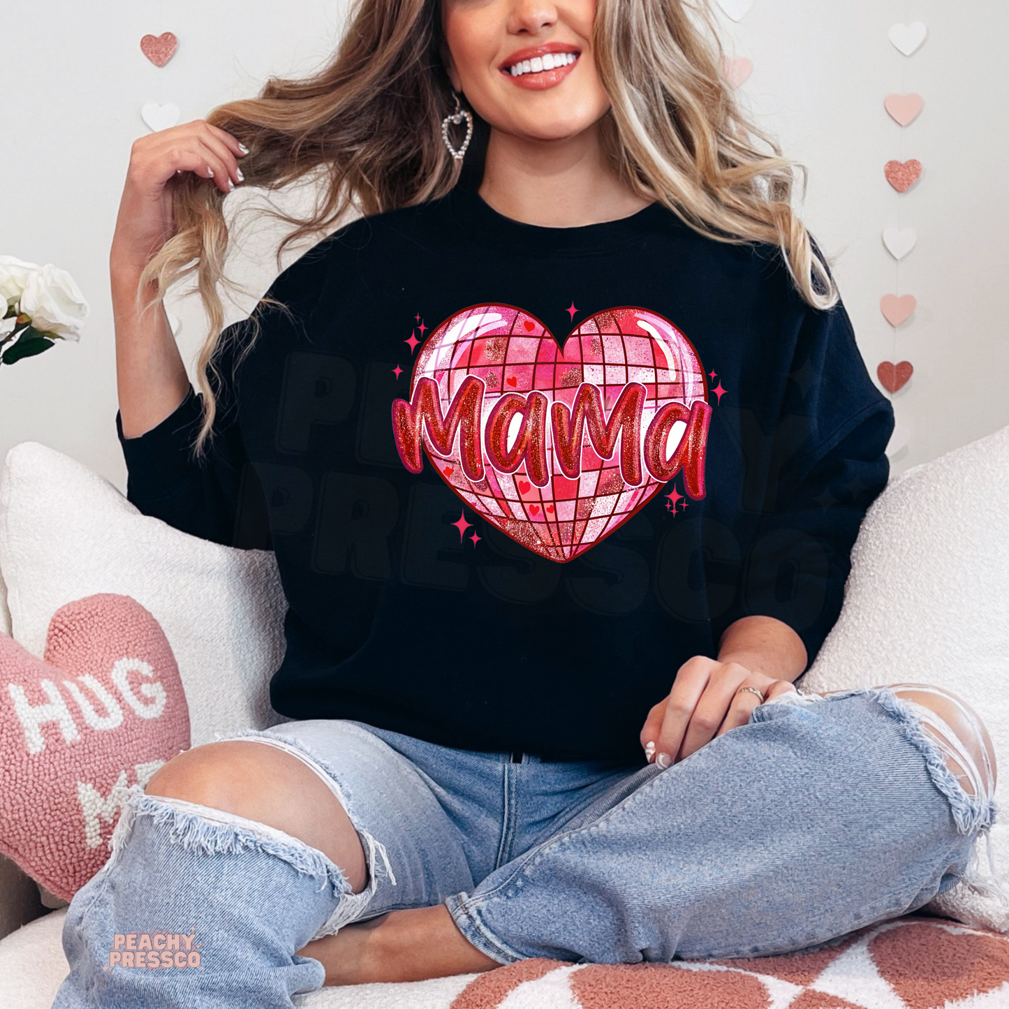 Black sweatshirt showcasing a vibrant pink disco heart with Mama lettering for a bold Valentine's Day mom outfit.