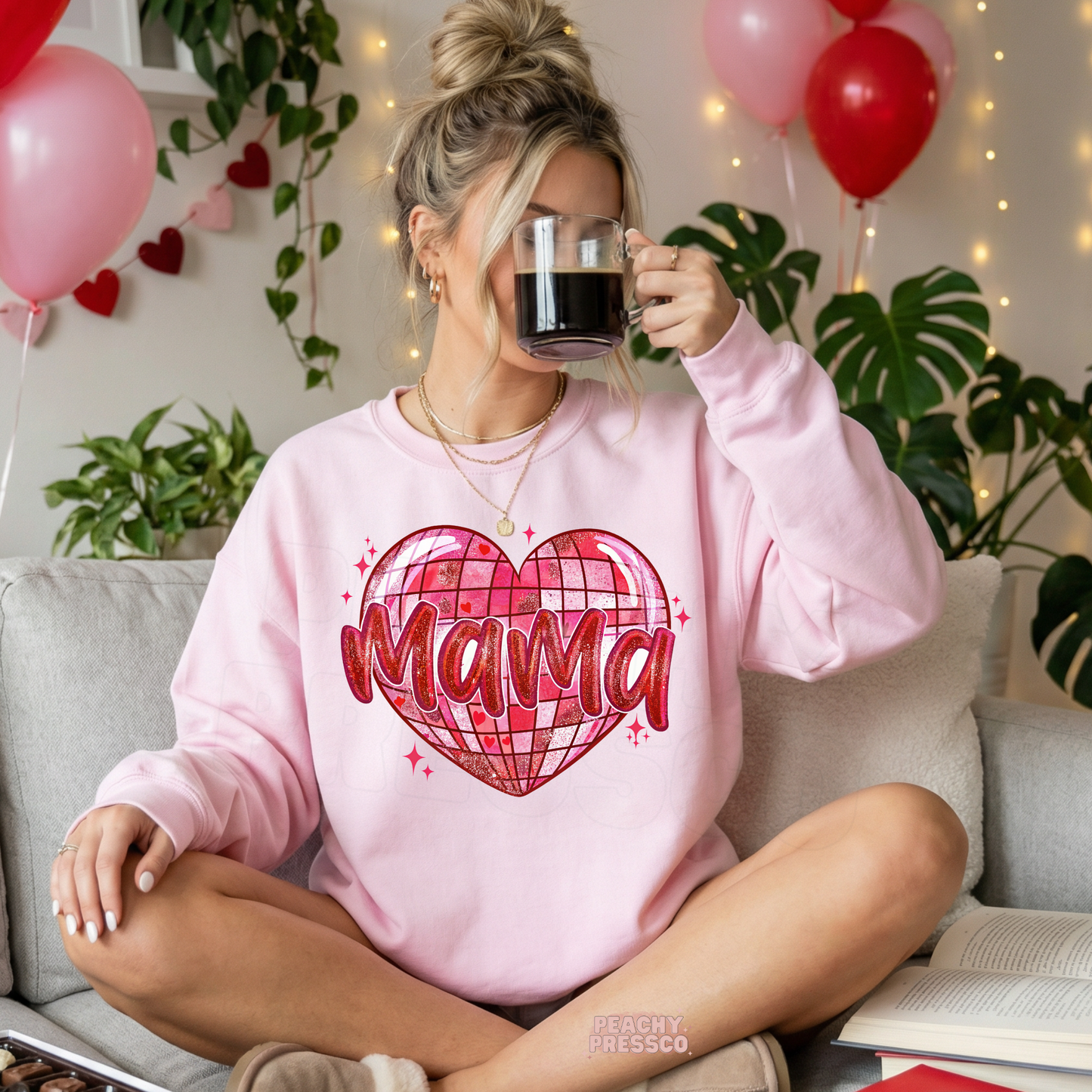 Light pink sweatshirt featuring a glittery disco heart with Mama text, perfect as a cozy Valentine's Day gift for moms.