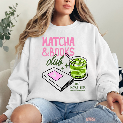 Woman wearing a white crewneck sweatshirt featuring the Matcha & Books Club graphic with an iced matcha drink, illustrated book, and reading-inspired artwork. Cozy oversized sweatshirt for readers and book lovers.