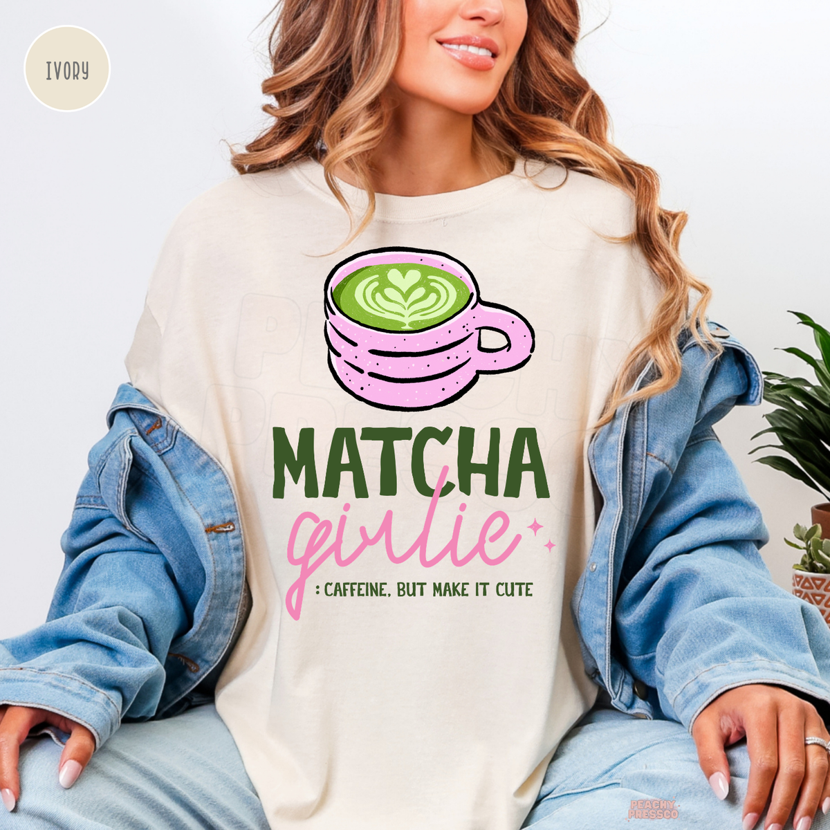 Ivory Matcha Girlie shirt with illustrated pink matcha latte mug, green matcha heart design, playful pink lettering, and cute sparkles.