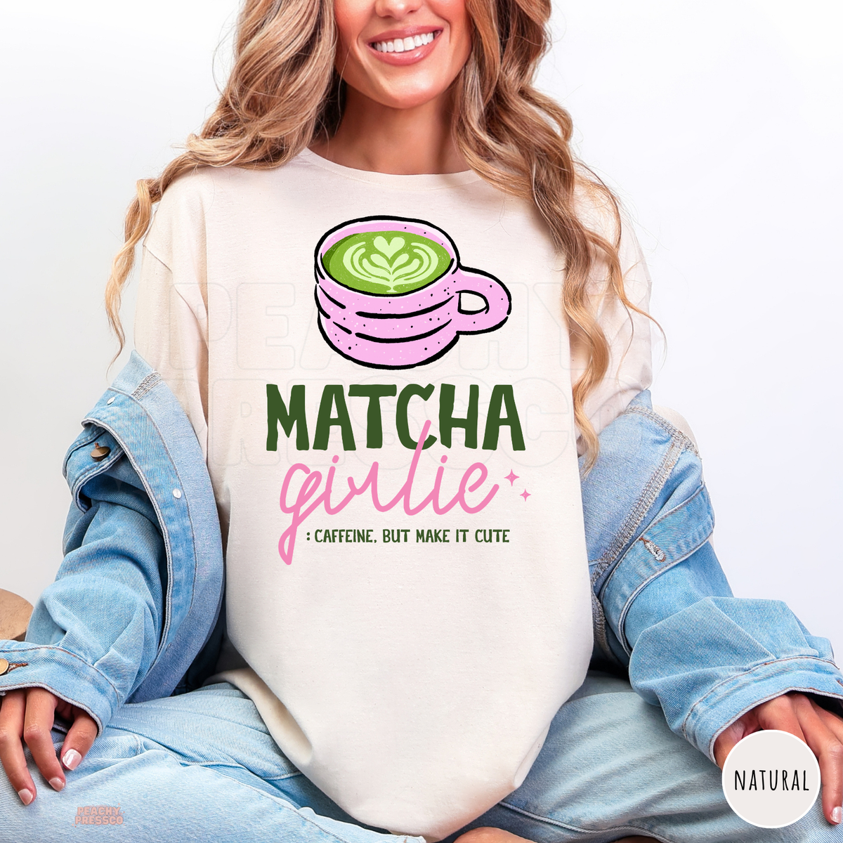 Natural Matcha Girlie shirt featuring a pink matcha latte cup with green heart latte art, pink lettering, and Caffeine But Make It Cute quote.