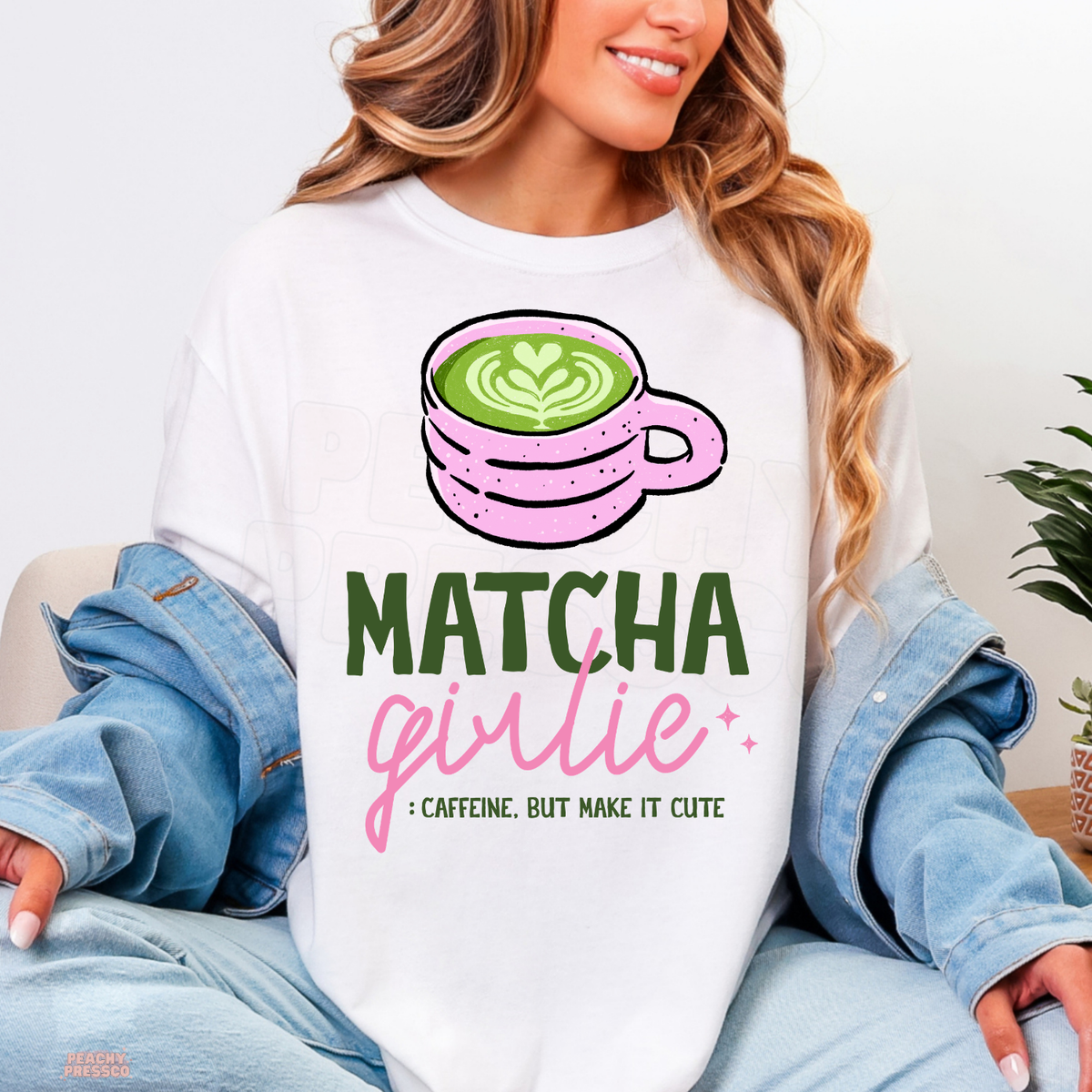 White Matcha Girlie shirt with cute pink coffee cup, green matcha heart latte art, bold green lettering, and pink girly typography.