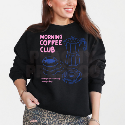 Black Morning Coffee Club sweatshirt featuring bright pink typography, blue line art coffee maker, coffee mug and toast for coffee lovers.