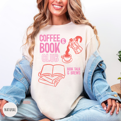 Natural cream graphic t-shirt featuring a "Coffee & Book Club" design with stacked books, a coffee cup, and moka pot illustration in pink and coral for book lovers.