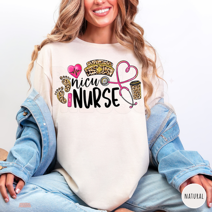 Natural NICU nurse shirt with leopard print baby footprints, pink heartbeat heart, nurse hat, coffee cup and heart-shaped stethoscope design.