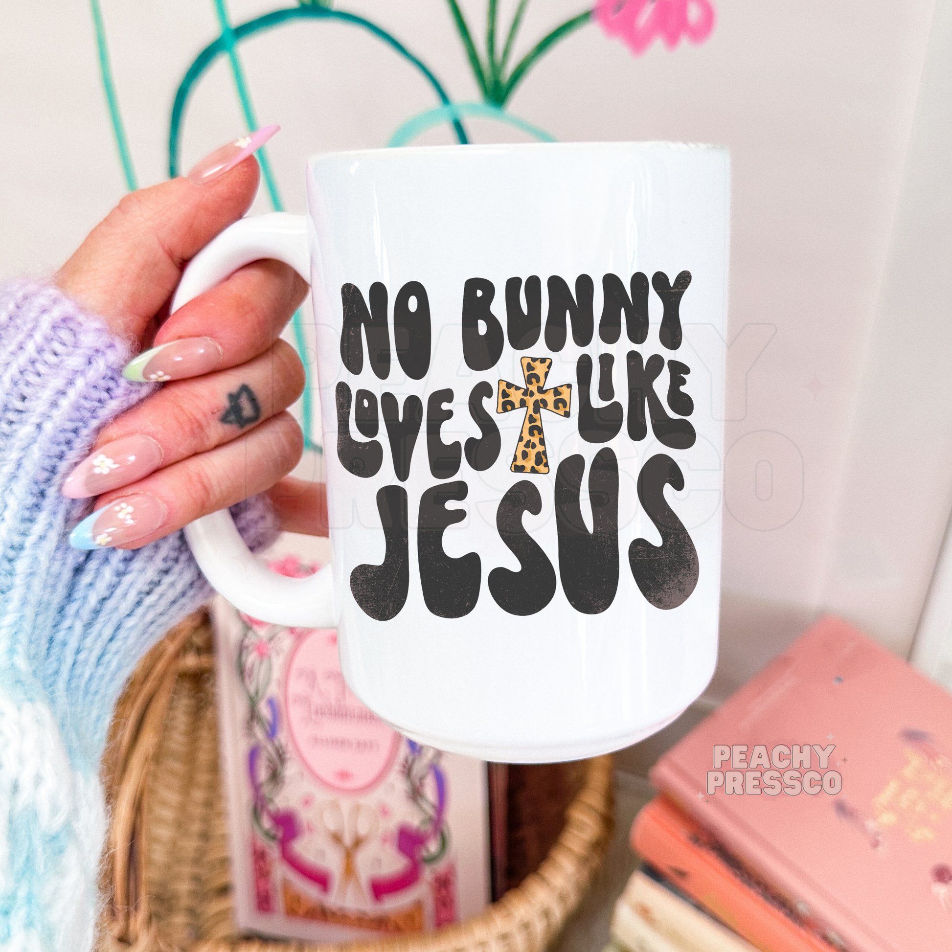 Christian Easter coffee mug featuring bold black typography with a leopard print cross reading "No Bunny Loves Like Jesus."