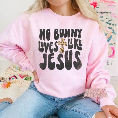 Pink crewneck sweatshirt featuring a No Bunny Loves Like Jesus Easter design with a leopard print cross.