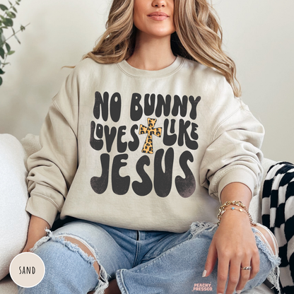 Sand crewneck sweatshirt with a No Bunny Loves Like Jesus Easter faith design and leopard print cross.
