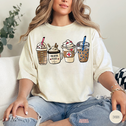 Ivory Nurse Fuel coffee T-shirt featuring iced coffee, whipped cream drinks, a stethoscope and medical-inspired details, styled with ripped blue jeans.