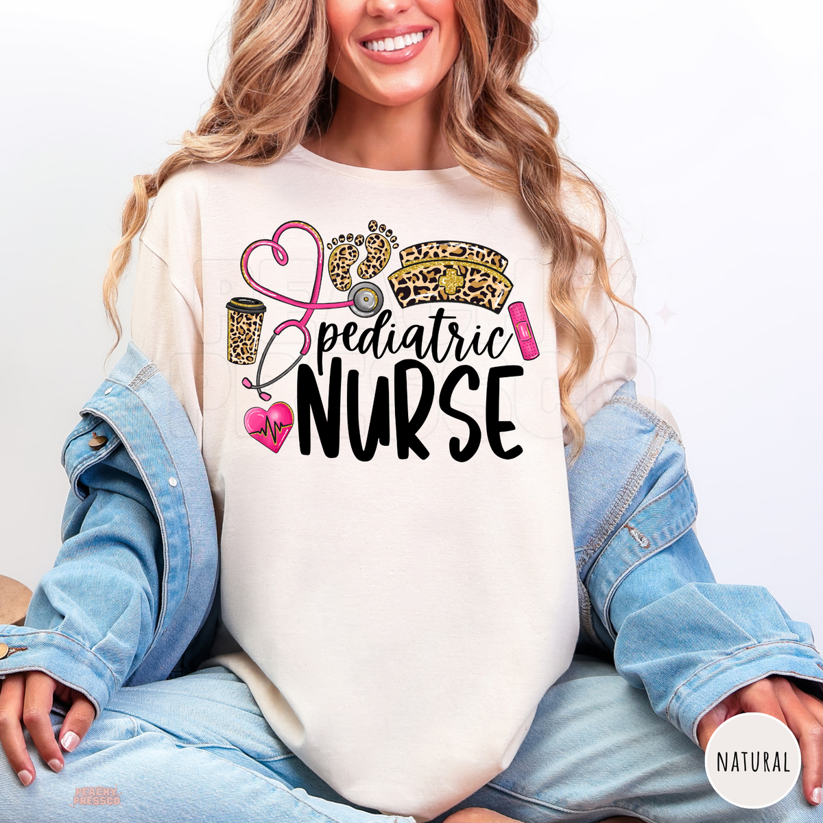 Natural pediatric nurse shirt with leopard print baby footprints, pink stethoscope heart, leopard nurse hat and black Pediatric Nurse lettering.