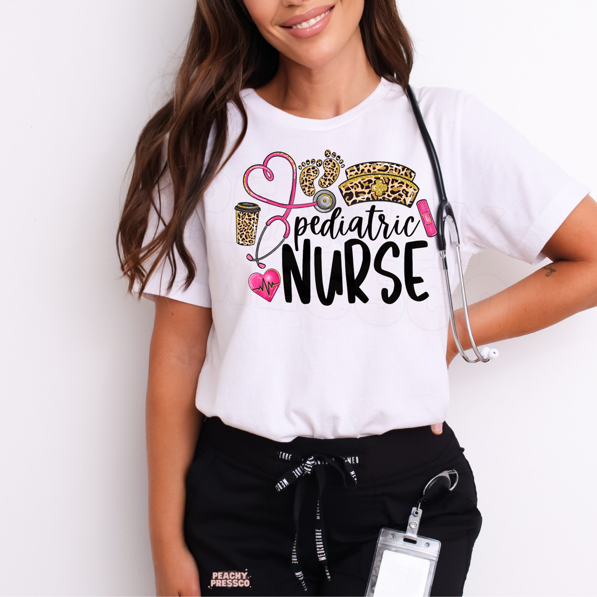 White pediatric nurse T-shirt featuring leopard print baby footprints, a pink heart-shaped stethoscope, nurse hat, coffee cup and bold Pediatric Nurse lettering.
