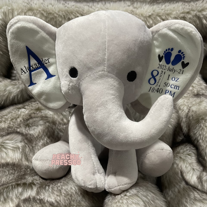 Personalized gray elephant stuffed animal with a custom baby boy name and embroidered birth details including date, weight, length, and birth time, making a thoughtful newborn keepsake.