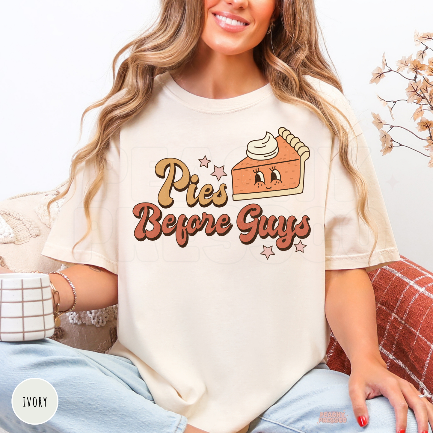Woman wearing an ivory Comfort Colors t-shirt with a cute "Pies Before Guys" pumpkin pie graphic, perfect for autumn and Thanksgiving.
