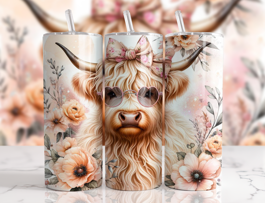 Cute Highland cow 20oz skinny tumbler featuring a fluffy cow wearing pink heart sunglasses and a floral bow, surrounded by blush flowers on a soft pastel background with a clear lid and reusable straw.