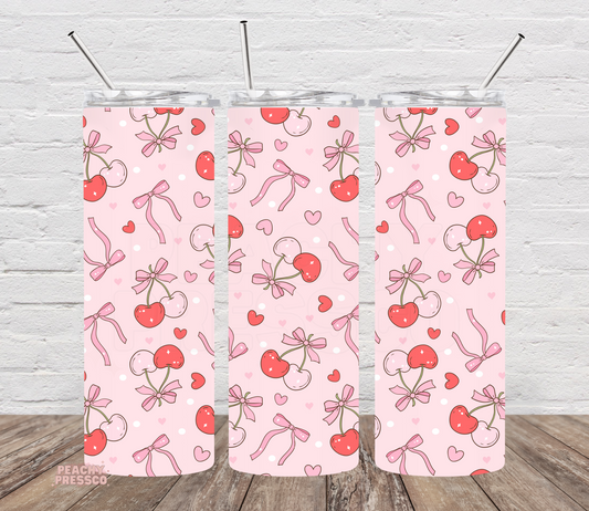 20oz skinny tumbler with a pink cherry pattern featuring bows, hearts, polka dots, and pastel cherries in a coquette-inspired aesthetic.