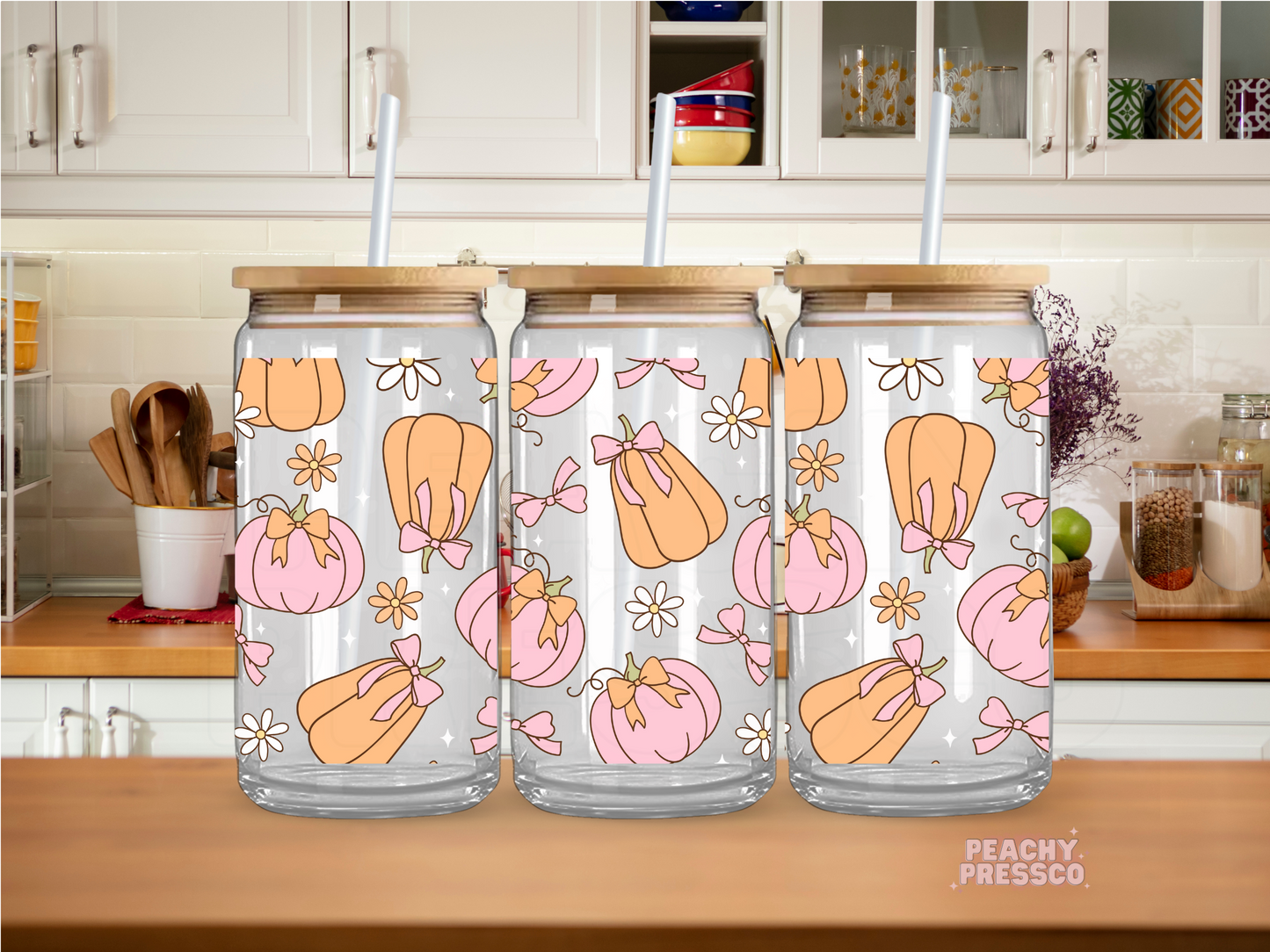 16oz glass cup featuring pink and peach pumpkins with bows, flowers, and a feminine coquette fall pattern.