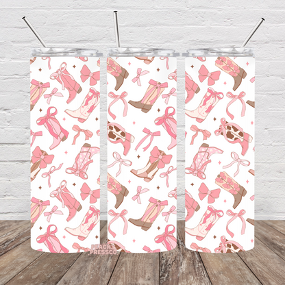 Girly Pink western tumbler featuring cowgirl boots, bows, ribbons, and feminine western pattern design.