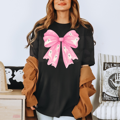 Black Halloween T-shirt featuring an oversized pink bow with cute white ghosts and stars for a girly spooky look
