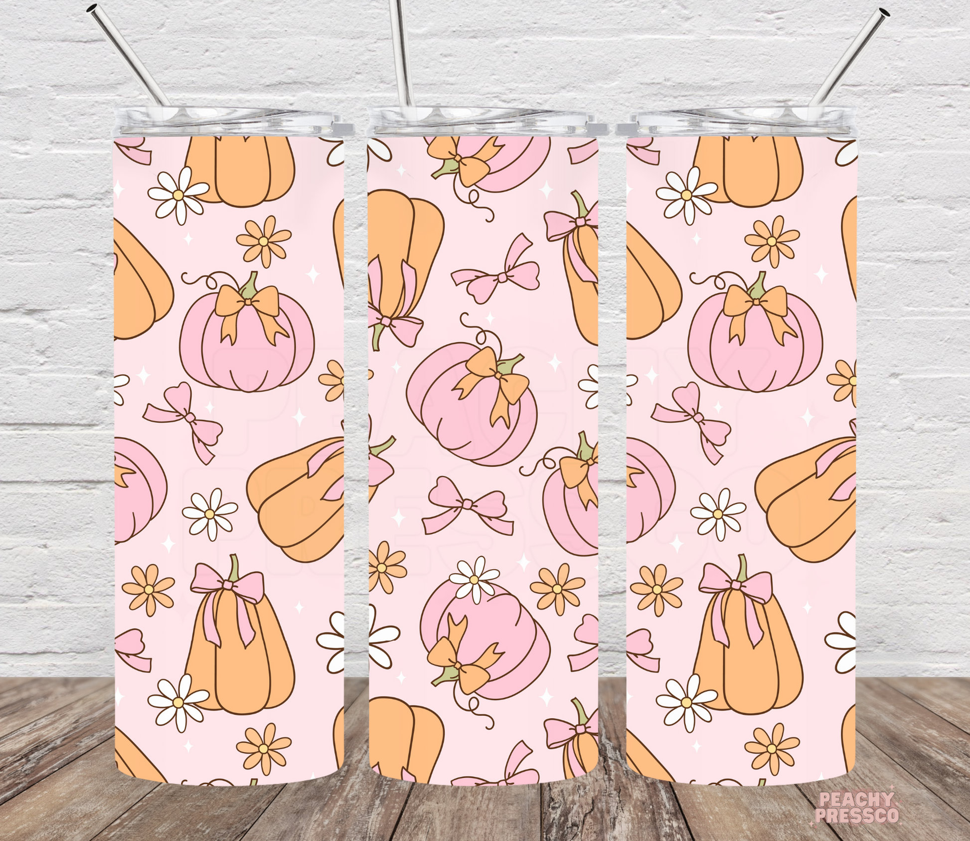20oz skinny tumbler featuring a pink pumpkin pattern with bows, daisies, and pastel coquette fall design on a light pink background.