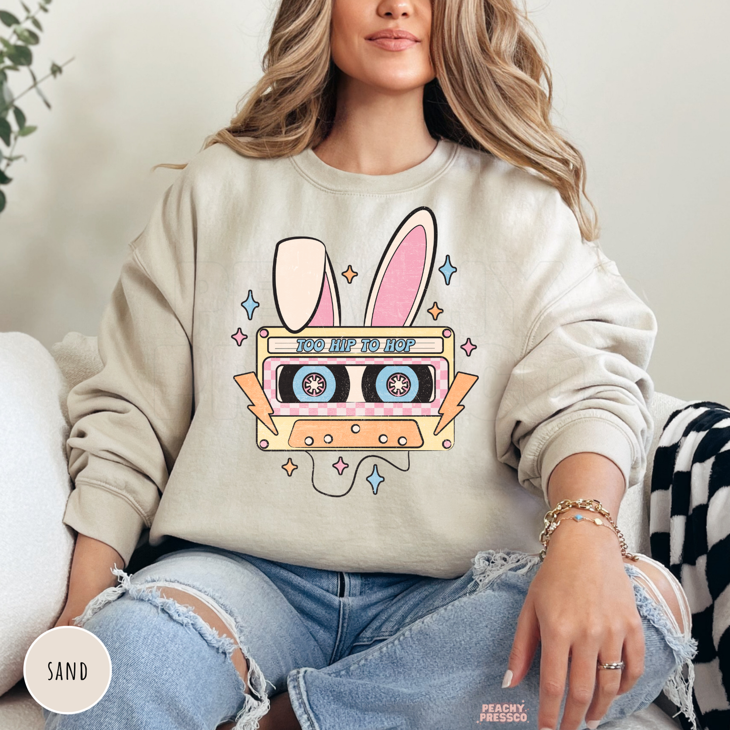 Sand crewneck sweatshirt featuring a retro bunny cassette tape design for Easter with pastel colors.