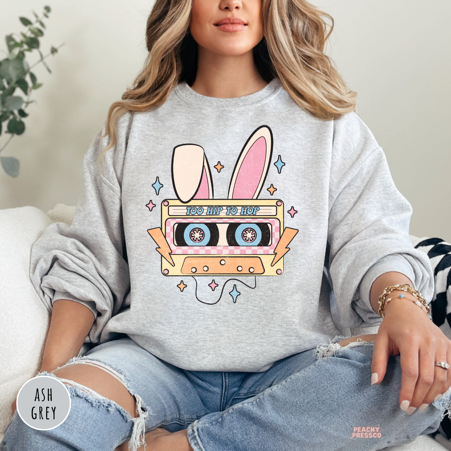 Ash grey crewneck sweatshirt featuring a vintage Easter bunny cassette tape graphic with pastel accents.