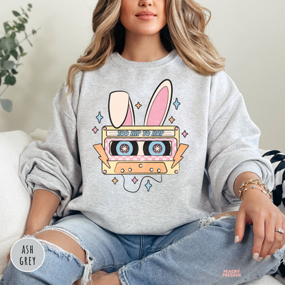 Ash grey crewneck sweatshirt featuring a vintage Easter bunny cassette tape graphic with pastel accents.