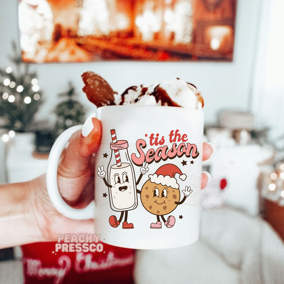 Christmas coffee mug featuring retro cartoon milk bottle and chocolate chip cookie holding hands with text Tis The Season.