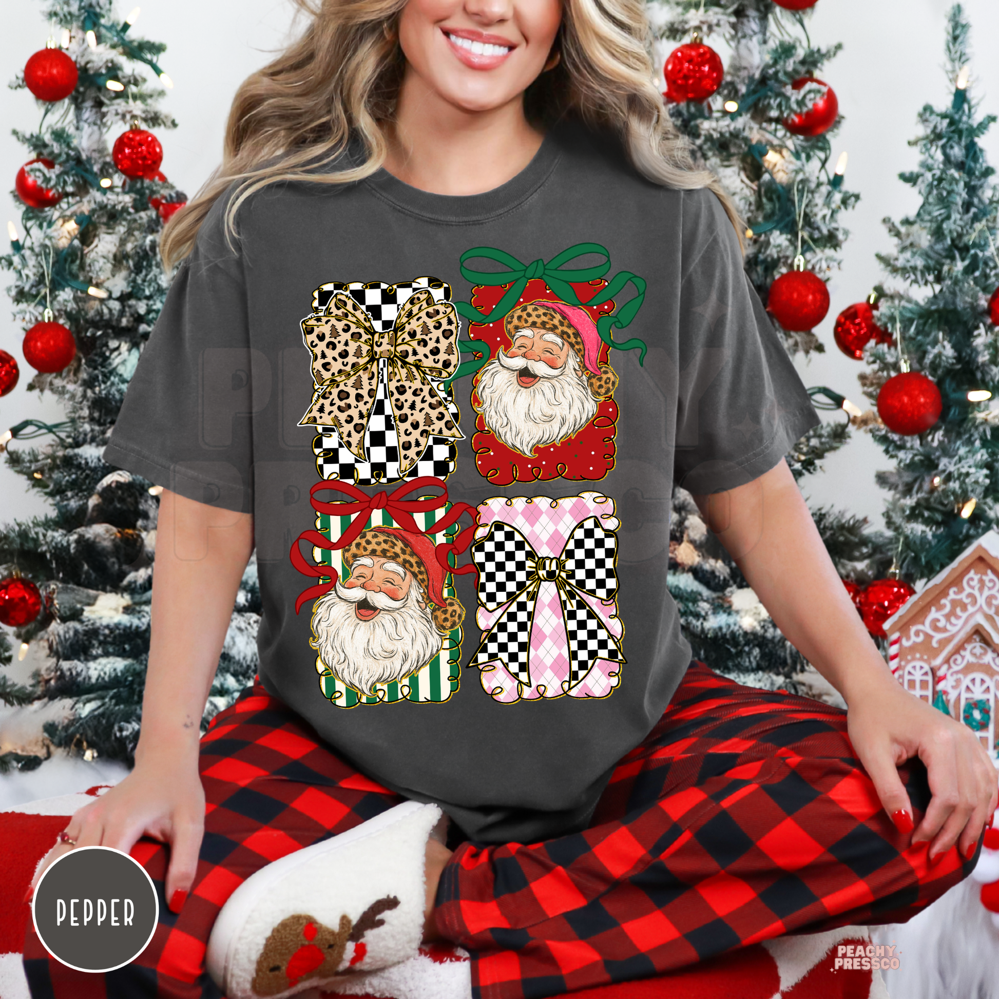 Woman wearing a comfort colors shirt in pepper paired with red and black buffalo plaid pajama pants.