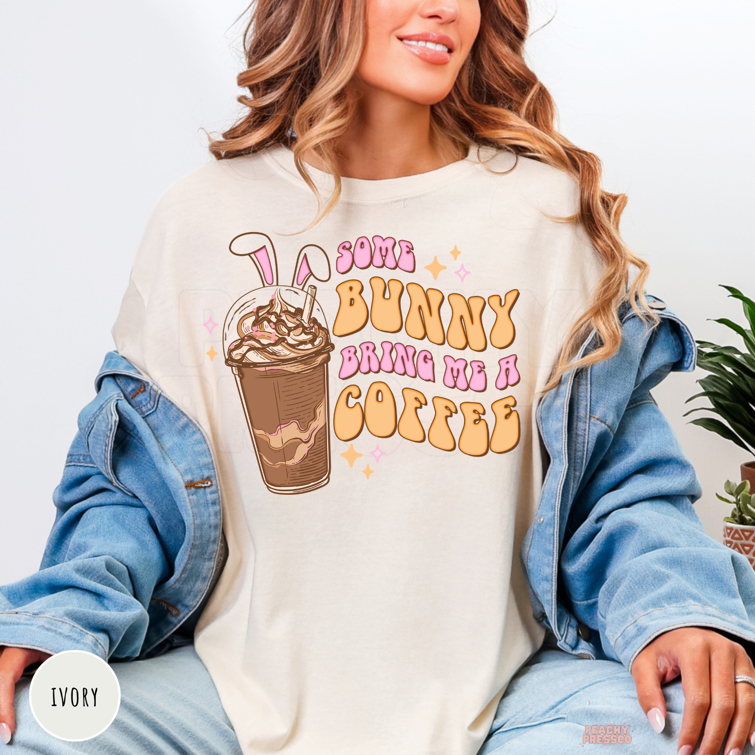 Ivory shirt displaying a playful Some Bunny Bring Me A Coffee Easter coffee lover graphic.