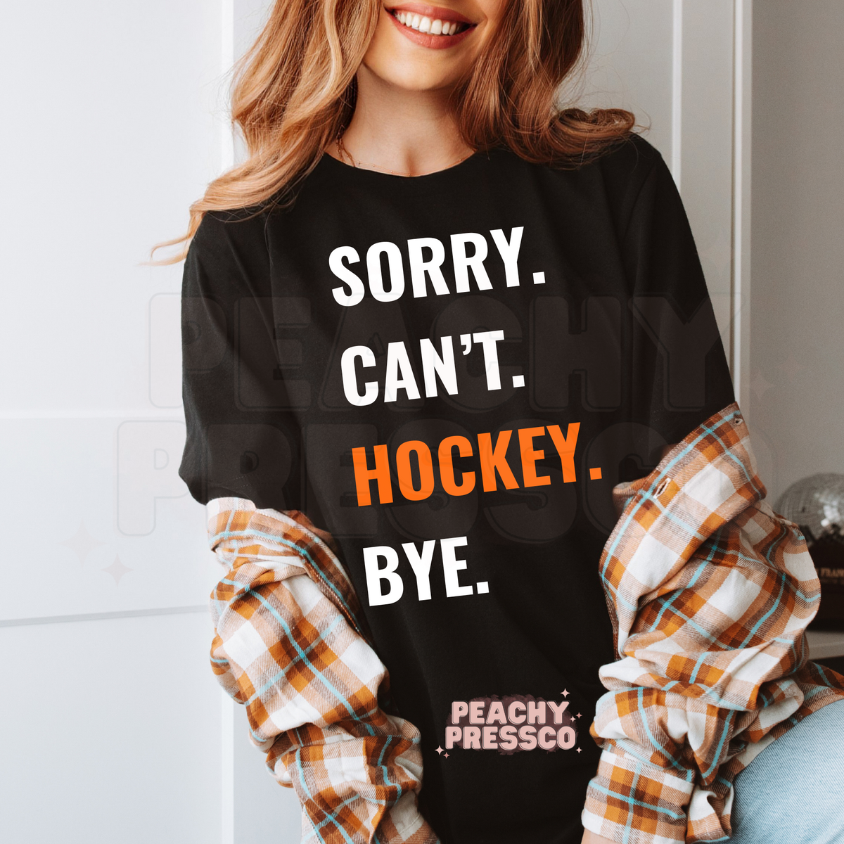 Black unisex graphic t-shirt featuring the funny "Sorry. Can't. Hockey. Bye." hockey fan design.