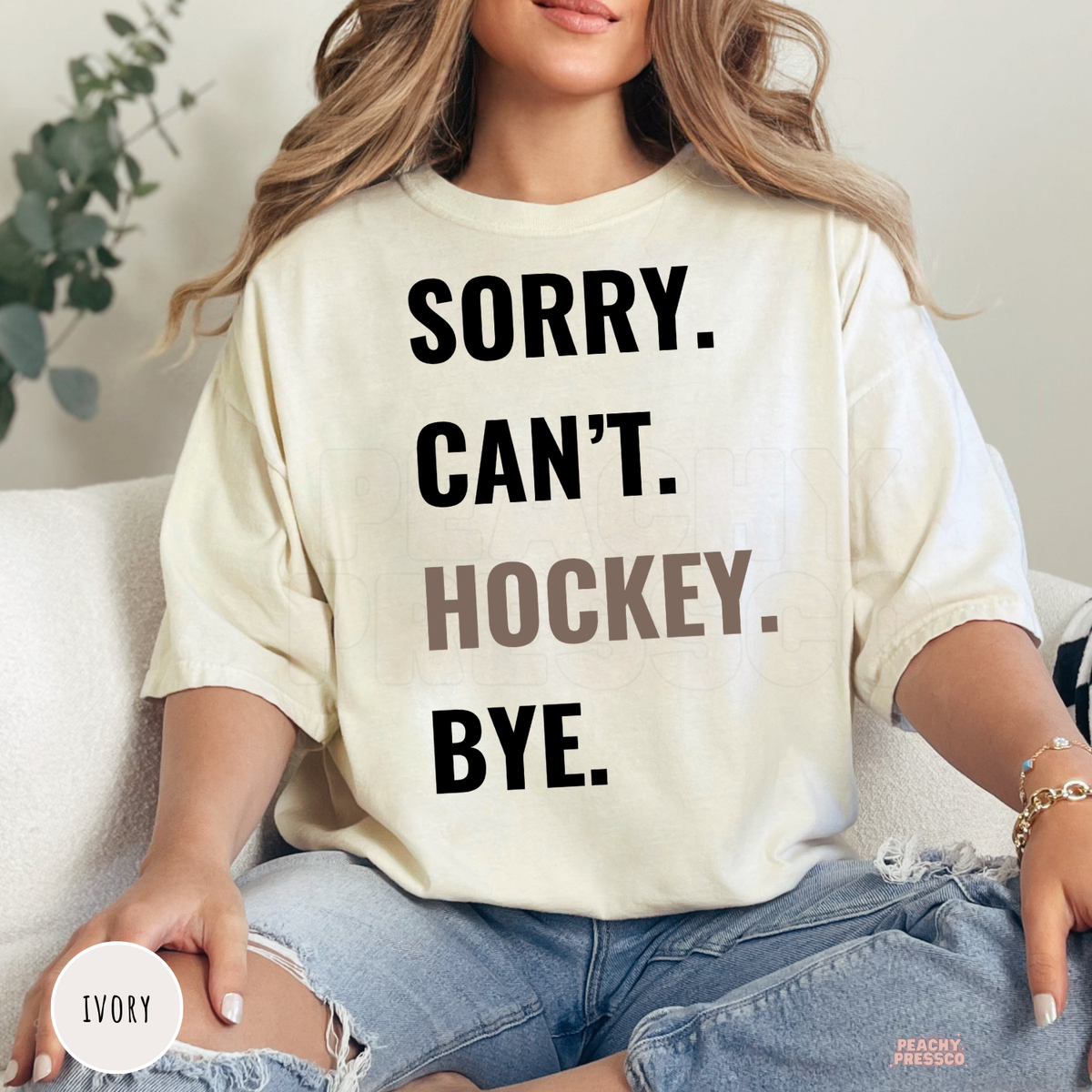 Ivory unisex graphic t-shirt with the funny "Sorry. Can't. Hockey. Bye." design for hockey enthusiasts.
