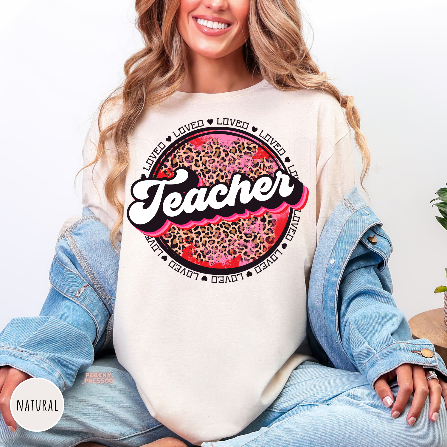 Natural shirt featuring a retro Teacher graphic with pink leopard print, heart accents, and Valentine's-inspired typography.