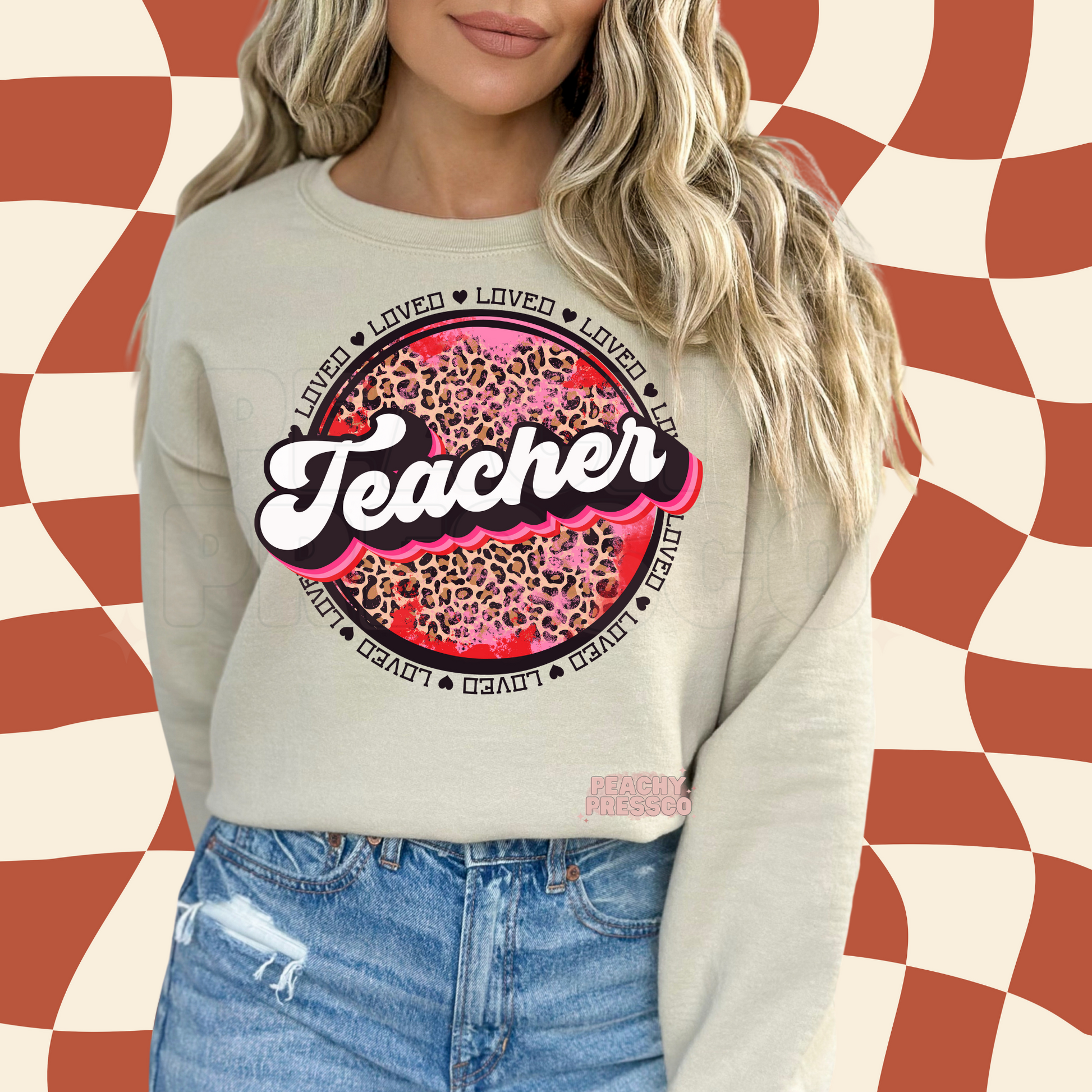 Sand crewneck sweatshirt showcasing a stylish retro Teacher graphic with leopard print, pink accents, and Valentine's-inspired design.