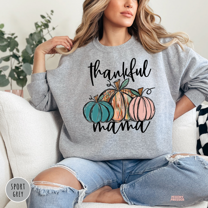 Sport grey crewneck sweatshirt featuring a "Thankful Mama" design with colorful pumpkins, stylish fall clothing for moms.