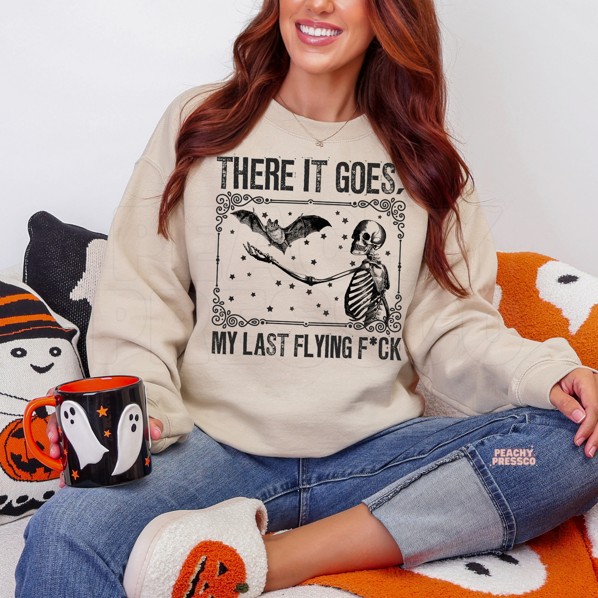 Sand There It Goes Halloween sweatshirt featuring a funny skeleton and flying bat vintage spooky graphic