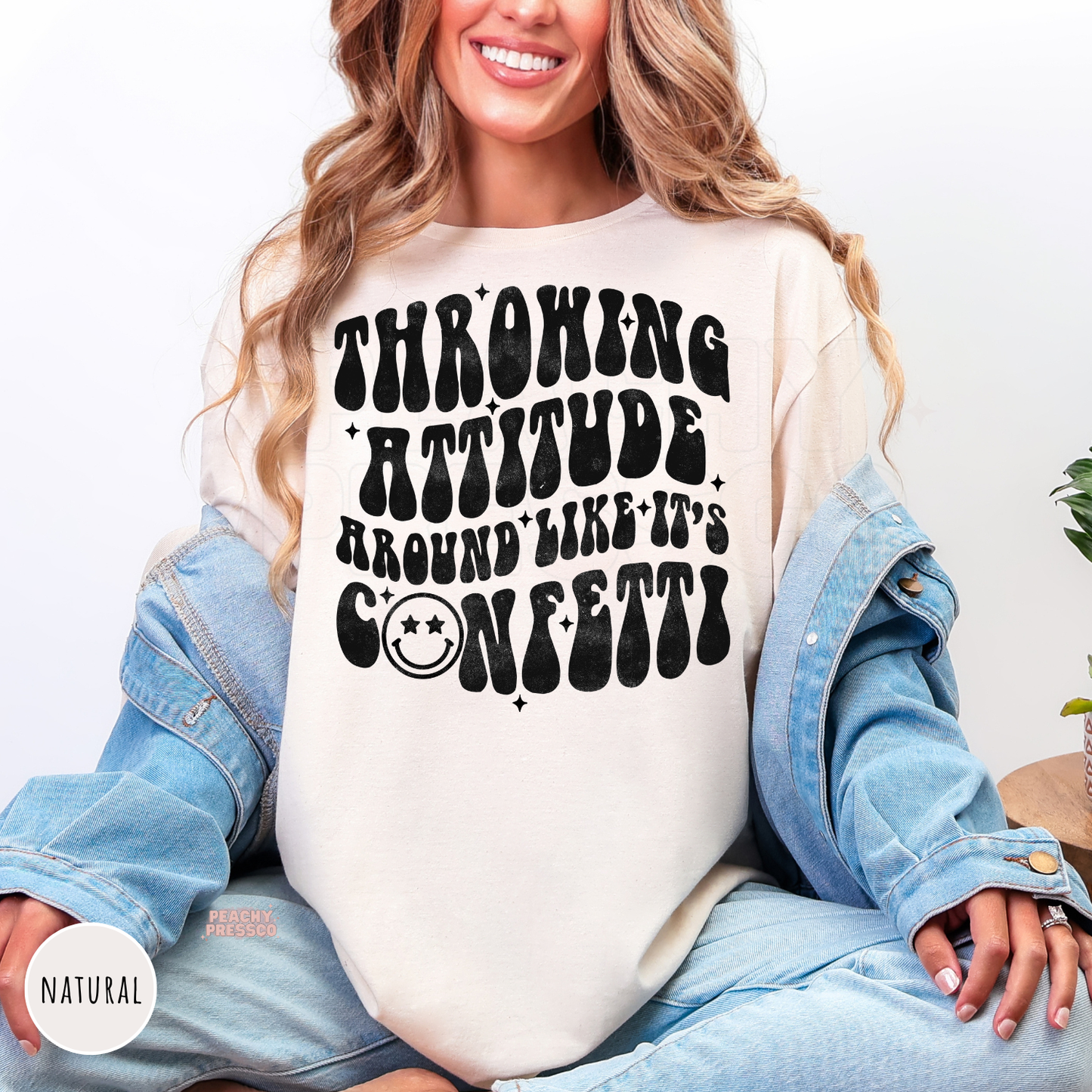 Natural shirt featuring the funny "Throwing Attitude Around Like It's Confetti" retro graphic with distressed black lettering.