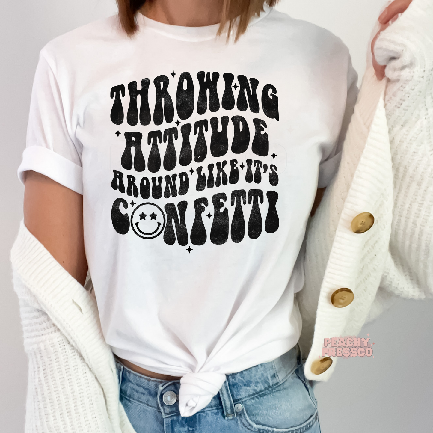 White unisex graphic t-shirt displaying the funny "Throwing Attitude Around Like It's Confetti" vintage-inspired design.