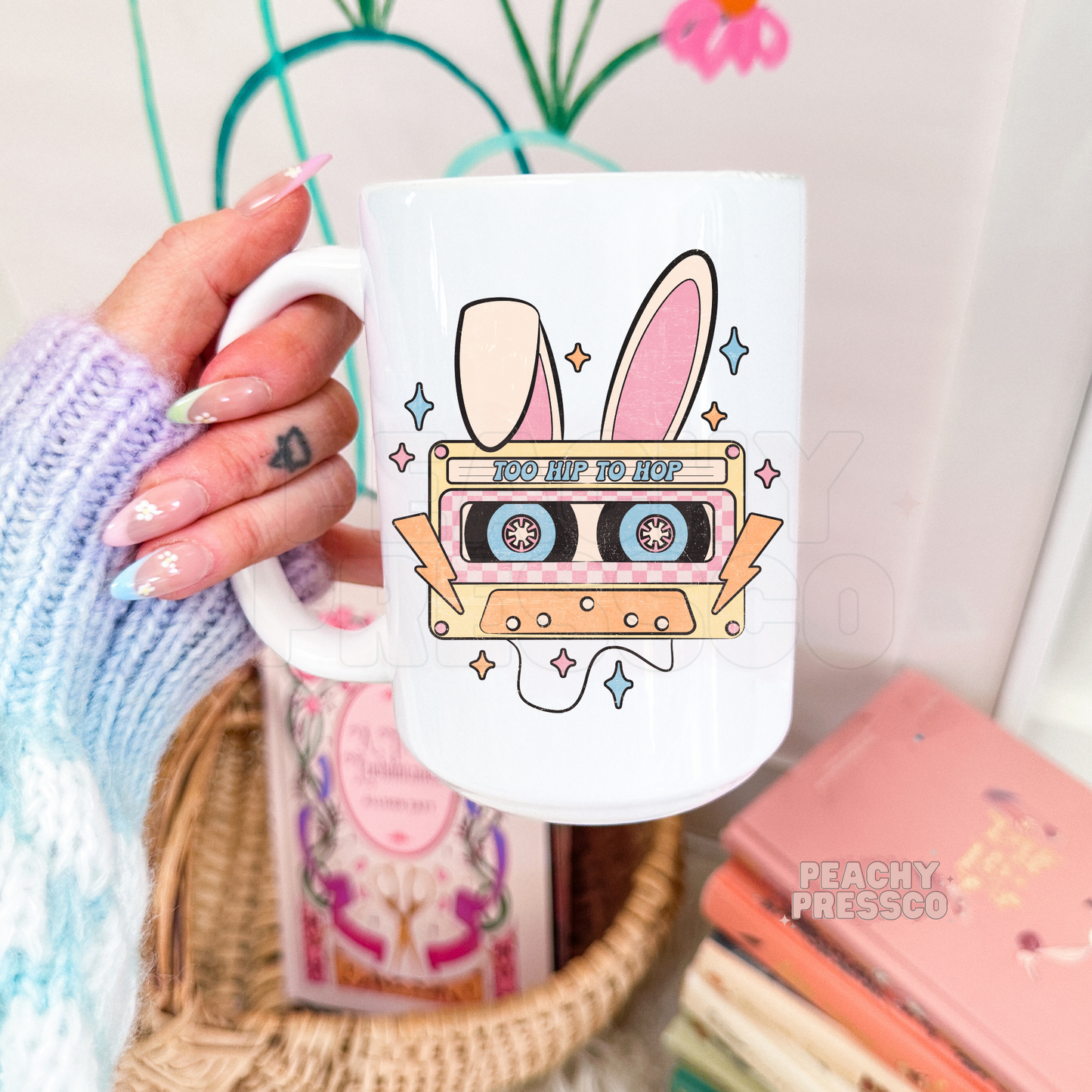 Retro Easter coffee mug featuring a vintage cassette tape with bunny ears, pastel colors, and the phrase "Too Hip to Hop."