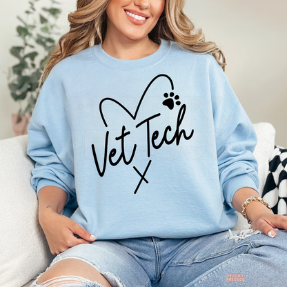 Light blue sweatshirt featuring a Vet Tech heart and paw print graphic, a cozy gift for veterinary technicians and veterinary assistants.