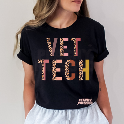 Black t-shirt featuring a colorful leopard print Vet Tech graphic, ideal for veterinary technicians, vet nurses, and animal lovers.