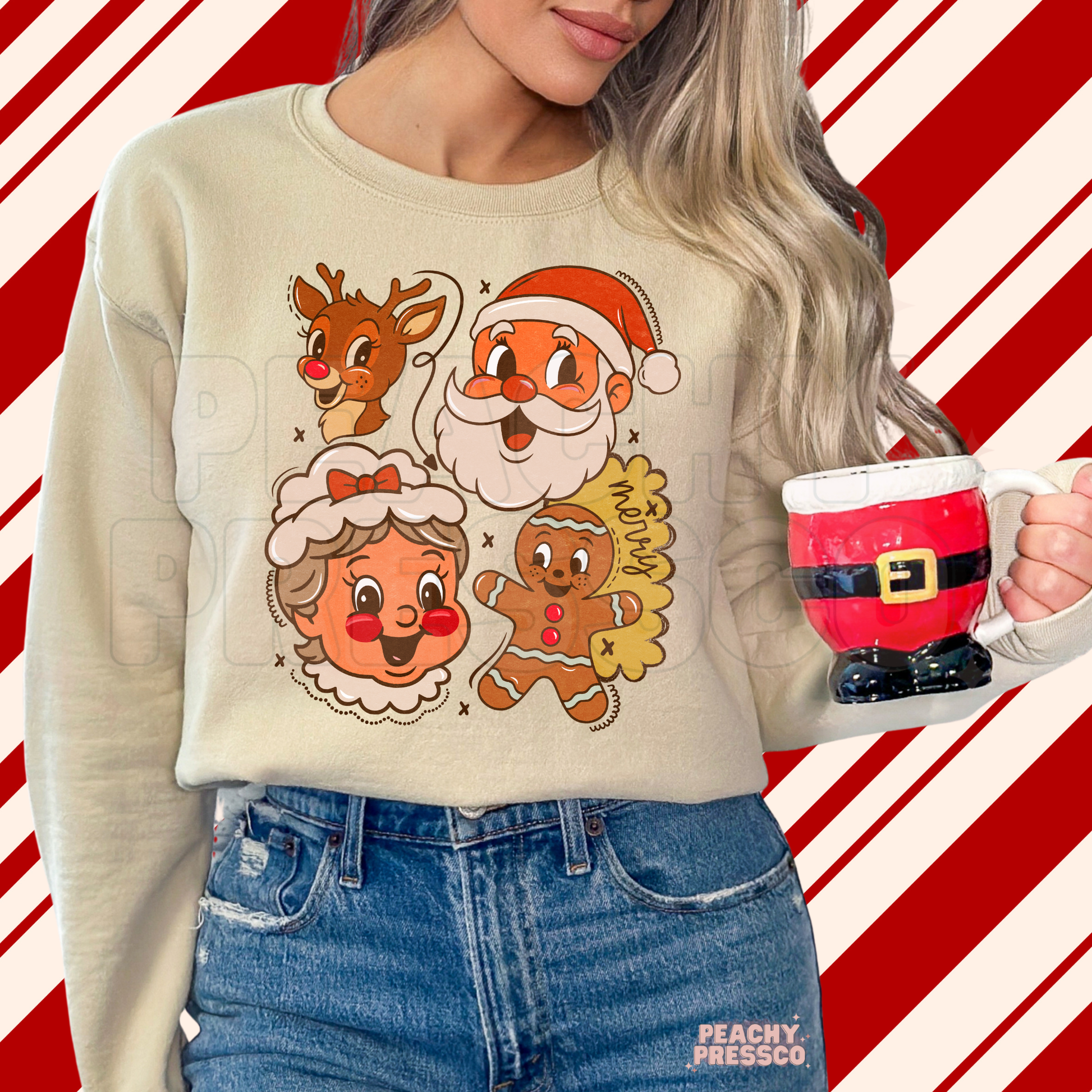 Woman holding a Santa mug wearing a sand crewneck sweatshirt with retro holiday character graphics.