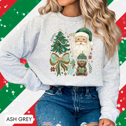 Women wearing an ash grey vintage green Santa Claus sweatshirt paired with blue denim jeans.