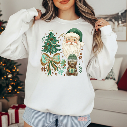 Women wearing a white vintage green Santa crewneck sweatshirt styled with pinstripe lounge shorts near a Christmas tree.