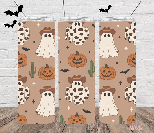 20oz skinny tumbler with repeating cowboy ghost, cow print ghost, pumpkins, bats and cactus western Halloween pattern.