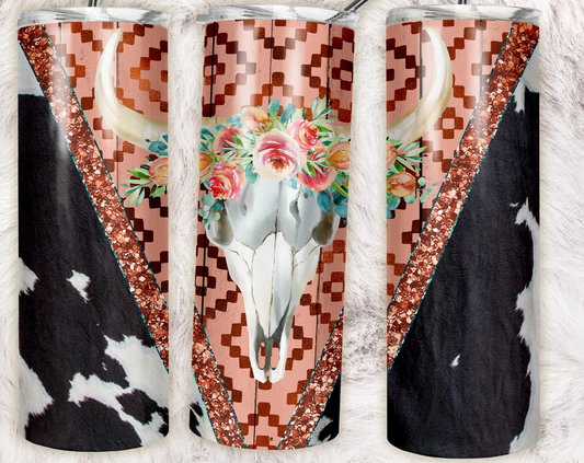 Western floral cow skull tumbler with pink Aztec print, glitter accents, flowers, and cowhide pattern.