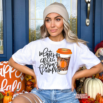 Woman wearing a white t-shirt featuring a "Whatever Spices Your Pumpkin" graphic with a trendy leopard print pumpkin coffee cup, perfect for fall coffee lovers.
