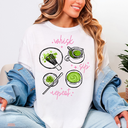 White Whisk Sip Repeat matcha shirt featuring hand-drawn matcha preparation illustrations, vibrant green tea, bamboo whisk, and pink sparkles.